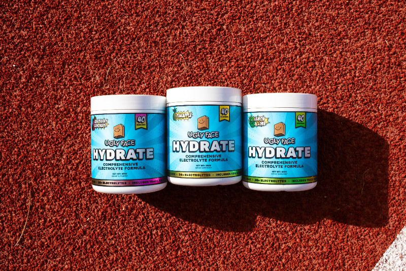 UGLY FACE Electrolytes 40 serves Three Products on Athletics Turf | Trusted by Australian athletes – Shop now at Strom Sports Australia.